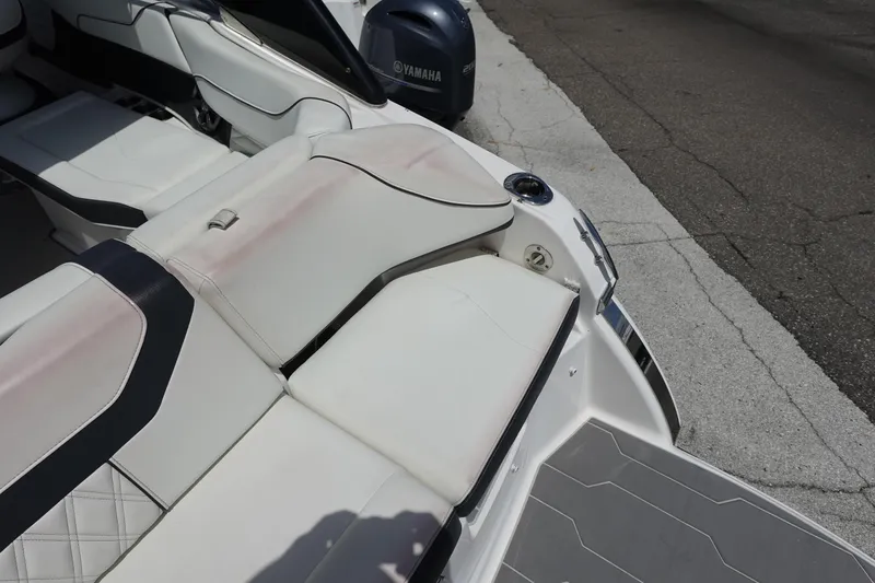 Slide: The Image of 2021 Regal 23 OBX boat interior with white seating and Yamaha engine. - 48