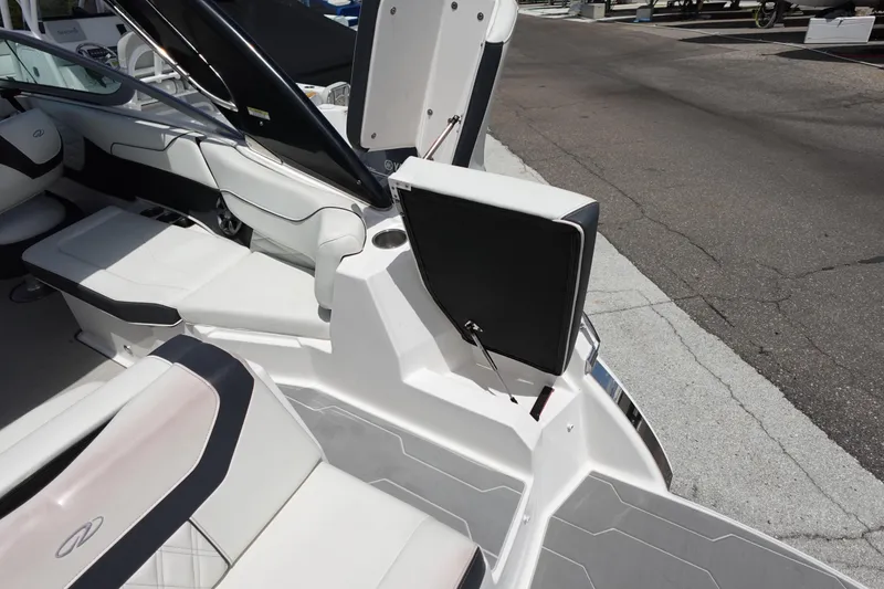 Slide: The Image of 2021 Regal 23 OBX boat interior with open storage compartment and seating. - 49