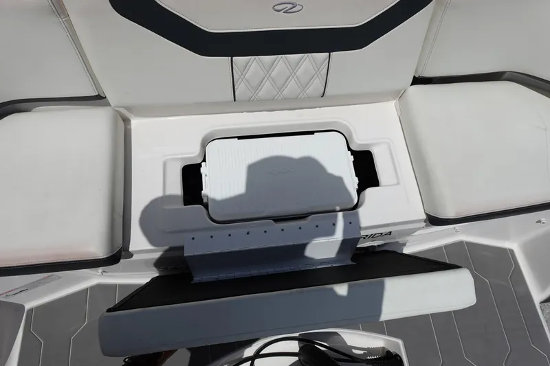Slide: The Image of 2021 Regal 23 OBX boat interior with seating and storage compartment. - 51