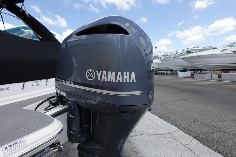Slide: The Image of Yamaha outboard motor on 2021 Regal 23 OBX boat, dockside view. - 55