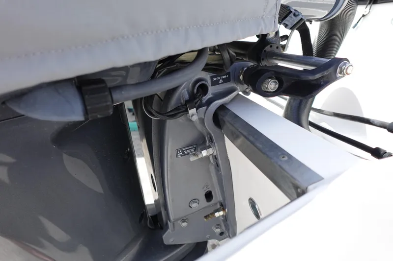 Slide: The Image of Close-up of 2021 Regal 23 OBX boat engine components and connections. - 58