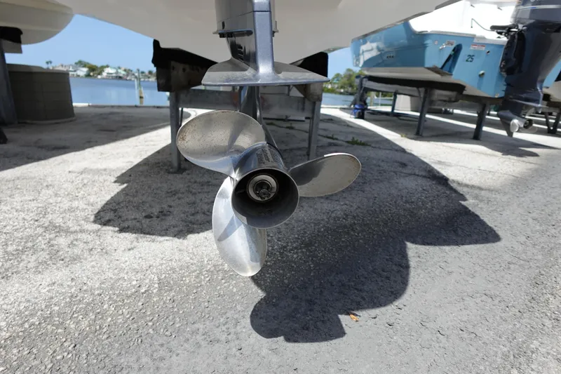 Slide: The Image of Propeller of 2021 Regal 23 OBX boat on dry dock, near waterfront. - 61