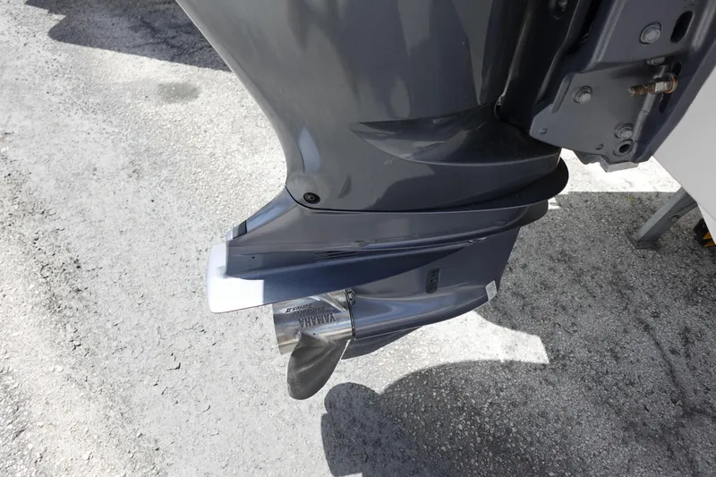 Slide: The Image of 2021 Regal 23 OBX outboard motor with Yamaha propeller on concrete surface. - 63