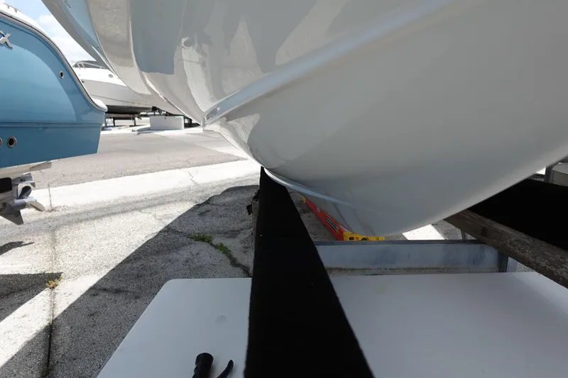 Slide: The Image of 2021 Regal 23 OBX boat hull on trailer, close-up view. - 67