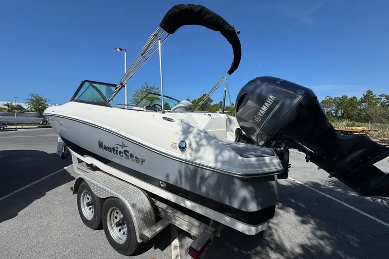 Slide: The Image of 2023 NauticStar 243 DC boat on trailer with Yamaha outboard motor. - 5