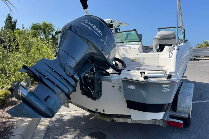 Slide: The Image of 2023 NauticStar 243 DC boat with Yamaha outboard motor on trailer. - 4