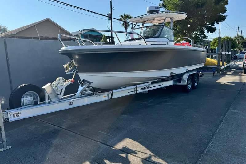 Slide: The Image of 2025 Nimbus Tender 8 boat on trailer in outdoor setting. - 12