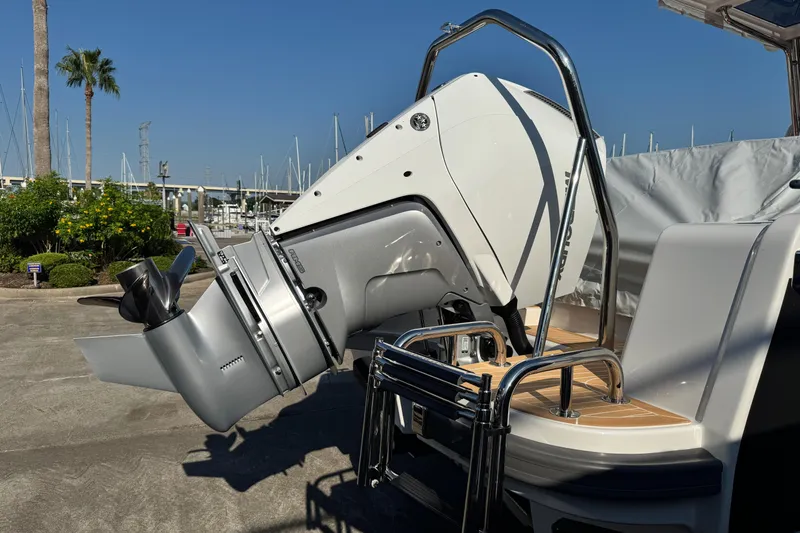 Slide: The Image of 2025 Nimbus Tender 8 boat with Mercury outboard motor at marina. - 15