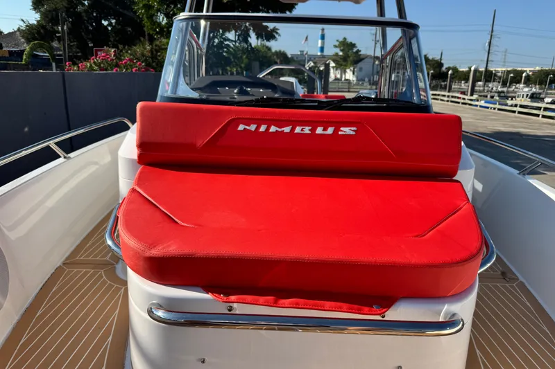 Slide: The Image of 2025 Nimbus Tender 8 boat with red seating and sleek design. - 18