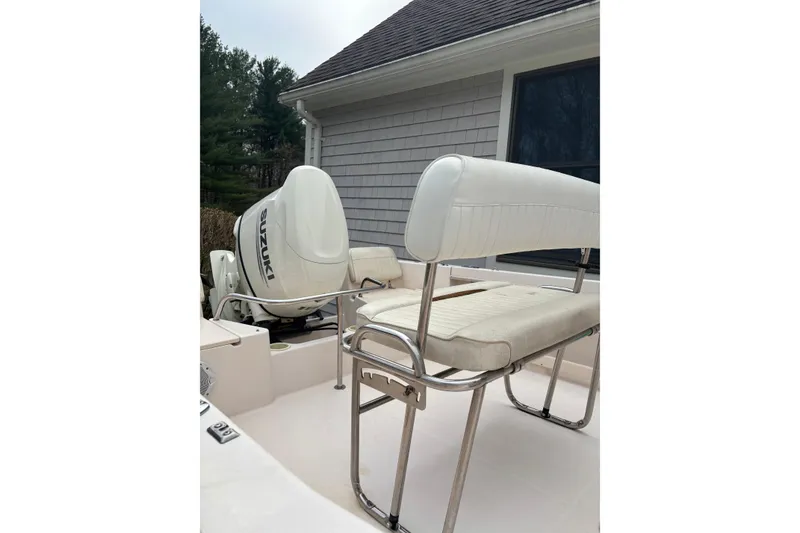 Slide: The Image of 2001 Grady-White Fisherman 180 boat with Suzuki outboard motor and cushioned seating. - 10