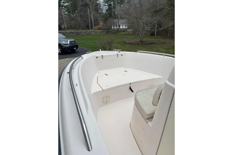 Slide: The Image of 2001 Grady-White Fisherman 180 boat interior with seating and storage, parked outdoors. - 3
