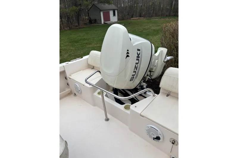 Slide: The Image of 2001 Grady-White Fisherman 180 boat with Suzuki outboard motor in a grassy yard. - 6