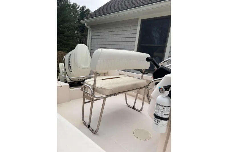 Slide: The Image of 2001 Grady-White Fisherman 180 boat interior with seating and Suzuki outboard motor. - 8