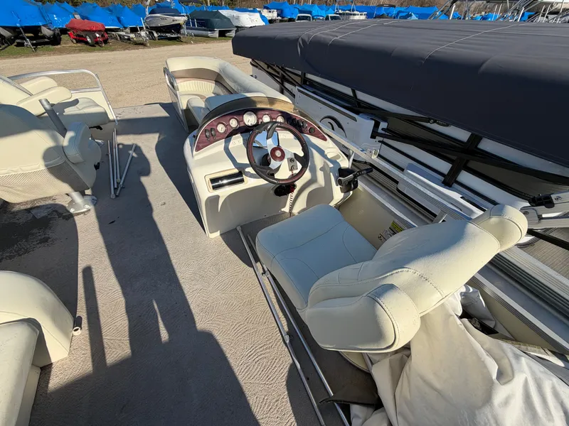 Slide: The Image of Interior of a 2008 Bennington 2250GL Pontoon boat with steering console. - 6