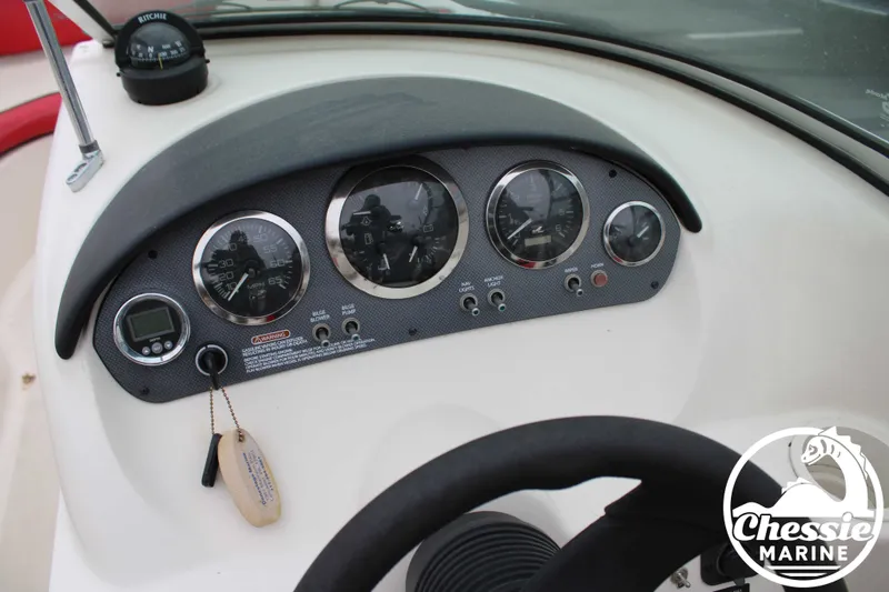 Slide: The Image of Dashboard of a 2006 Sea Ray 205 Sport boat with instruments. - 11