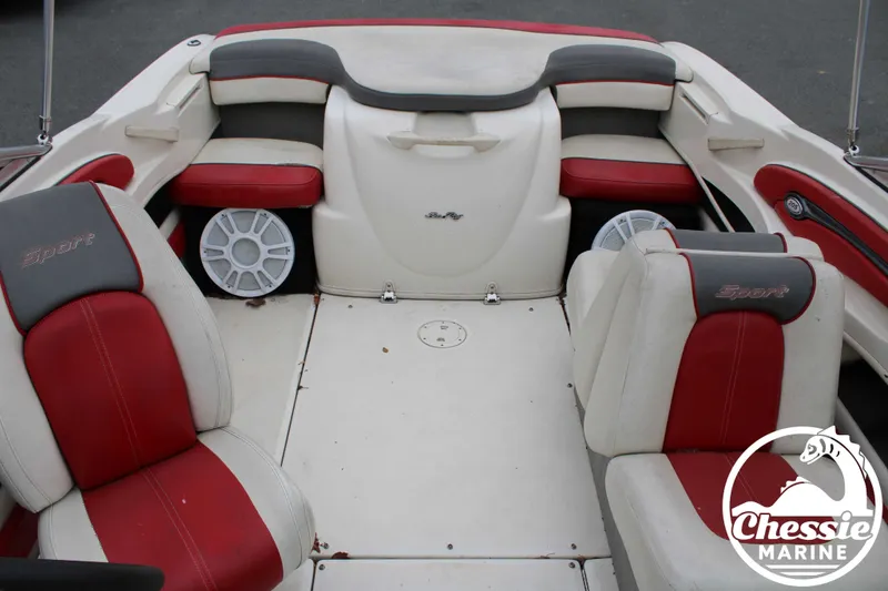 Slide: The Image of Interior of a 2006 Sea Ray 205 Sport boat with red seats. - 12