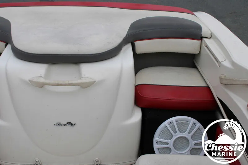 Slide: The Image of Interior of a 2006 Sea Ray 205 Sport boat with red and gray seating. - 14