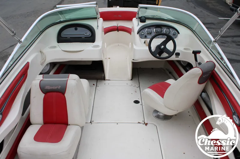 Slide: The Image of Interior of a 2006 Sea Ray 205 Sport boat with red seating. - 15