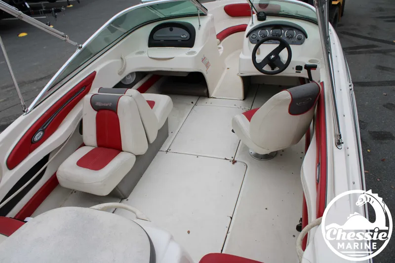 Slide: The Image of Interior of a 2006 Sea Ray 205 Sport boat with red seating. - 17
