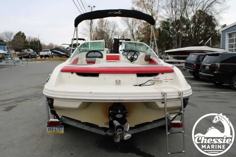 Slide: The Image of Rear view of a 2006 Sea Ray 205 Sport boat in a parking lot. - 5