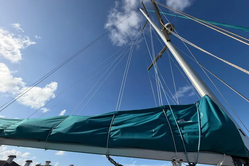 Slide: The Image of Sailboat mast and rigging of 1992 Hunter Passage 42 against a clear blue sky. - 11