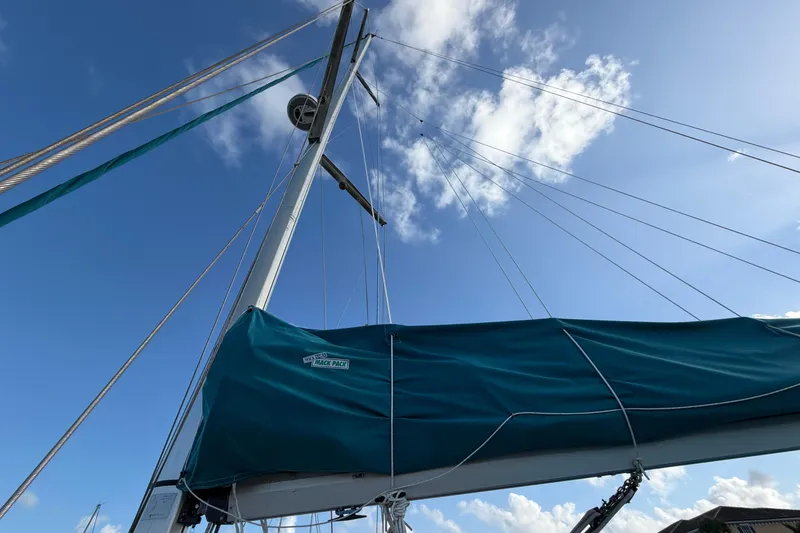 Slide: The Image of Sailboat mast and boom of 1992 Hunter Passage 42 against blue sky. - 12
