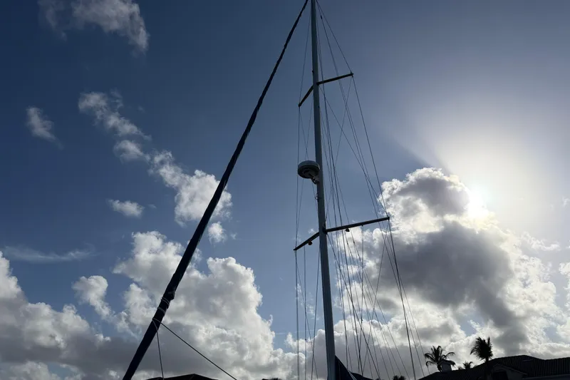 Slide: The Image of Sailboat mast of 1992 Hunter Passage 42 against a cloudy sky. - 13