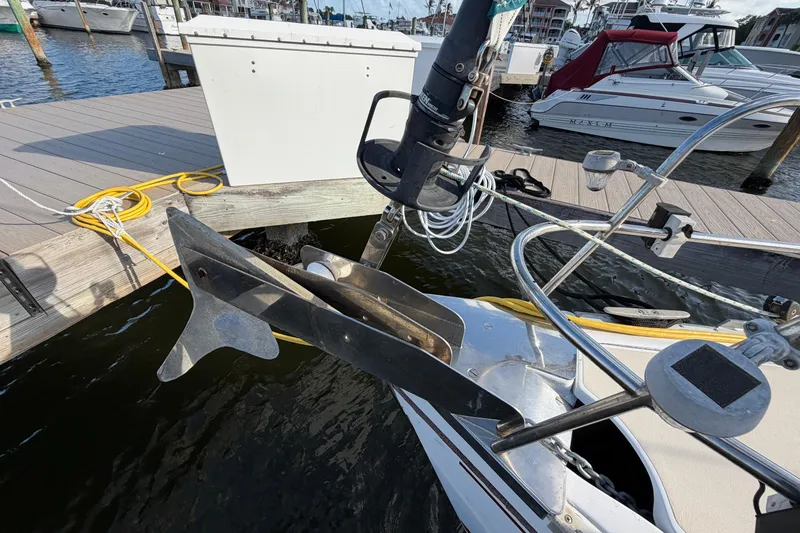 Slide: The Image of Bow of a 1992 Hunter Passage 42 sailboat with anchor at marina dock. - 16