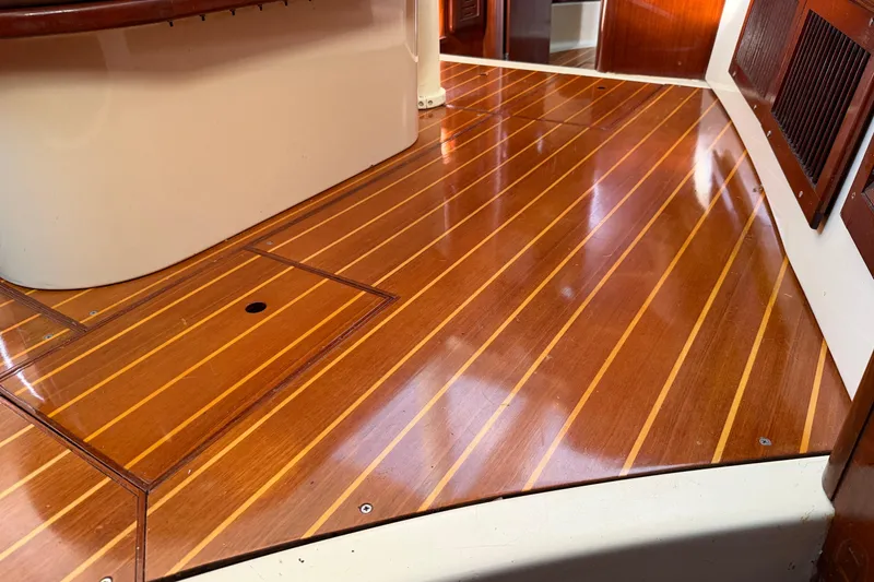 Slide: The Image of Polished wooden interior flooring of a 1992 Hunter Passage 42 sailboat. - 31