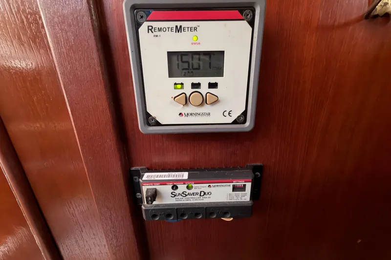 Slide: The Image of Remote meter and solar controller on 1992 Hunter Passage 42 yacht interior. - 35