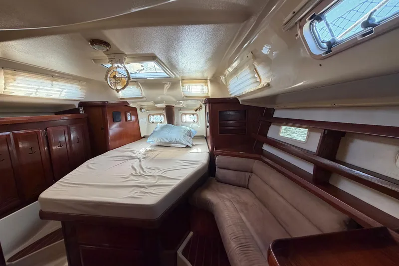 Slide: The Image of Interior of 1992 Hunter Passage 42 sailboat with cozy cabin and wooden furnishings. - 37