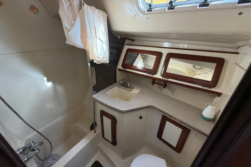 Slide: The Image of Bathroom interior of 1992 Hunter Passage 42 yacht with sink, shower, and storage. - 41