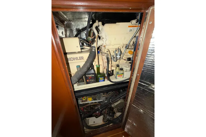 Slide: The Image of Engine compartment of a 1992 Hunter Passage 42 sailboat with Kohler generator. - 42