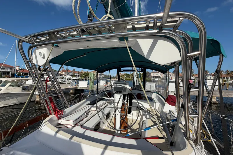 Slide: The Image of 1992 Hunter Passage 42 sailboat docked at marina under clear blue sky. - 5