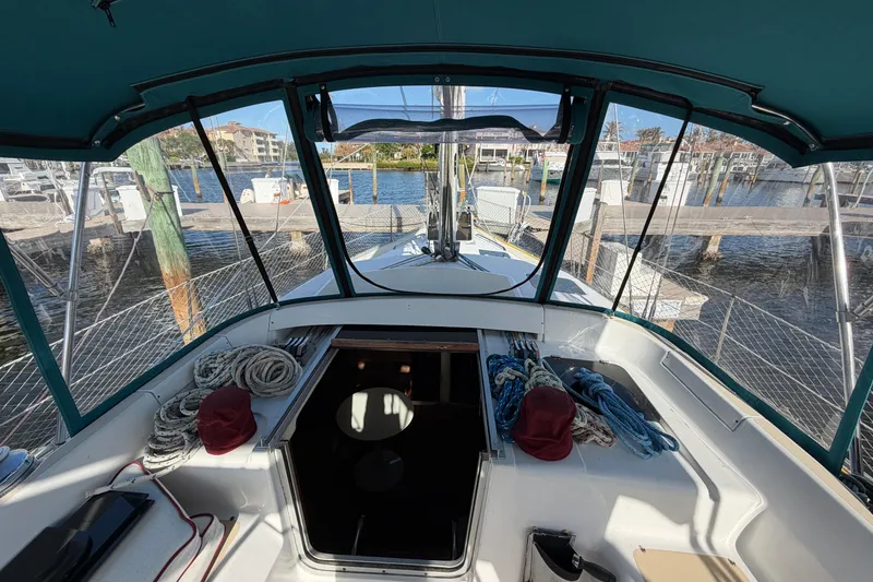 Slide: The Image of Cockpit view of 1992 Hunter Passage 42 sailboat docked at marina. - 7