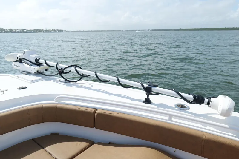 Slide: The Image of 2021 Sea Hunt Ultra 305 SE boat with Garmin equipment on calm waters. - 26