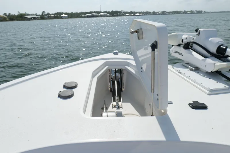 Slide: The Image of Bow of 2021 Sea Hunt Ultra 305 SE with open anchor hatch and Garmin equipment. - 31