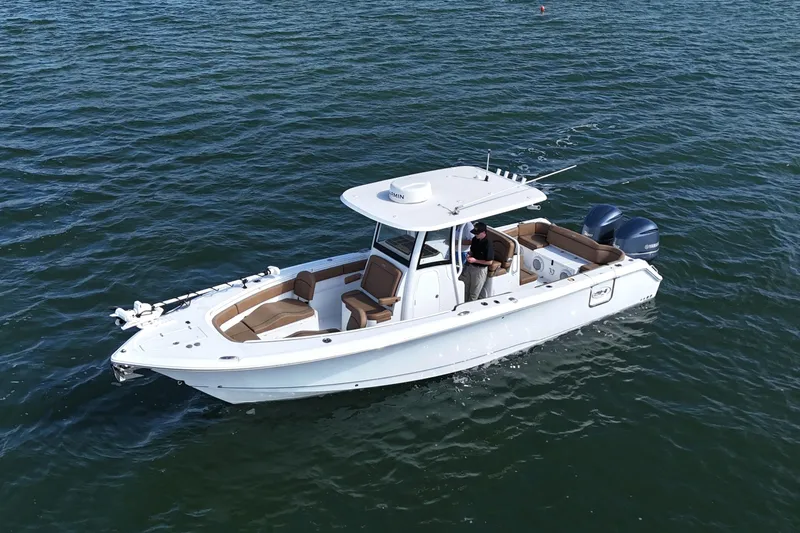 Slide: The Image of 2021 Sea Hunt Ultra 305 SE boat cruising on open water. - 33