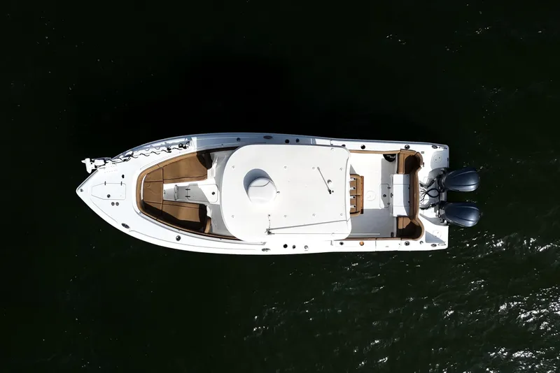 Slide: The Image of Aerial view of 2021 Sea Hunt Ultra 305 SE boat on dark water. - 34