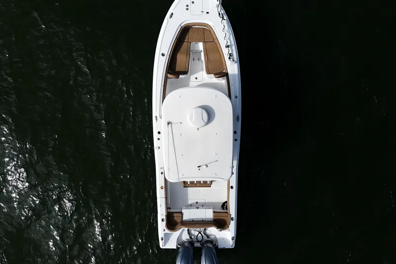 Slide: The Image of Aerial view of 2021 Sea Hunt Ultra 305 SE boat on dark water. - 35