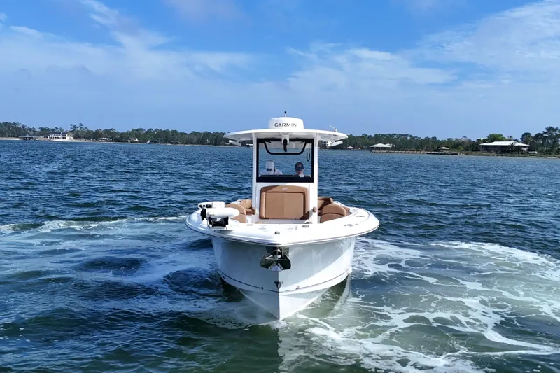 Slide: The Image of 2021 Sea Hunt Ultra 305 SE boat cruising on a sunny day. - 8