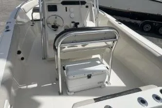 Slide: The Image of 2022 Sailfish 242 CC boat interior with steering console and seating. - 10