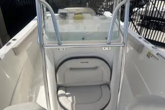 Slide: The Image of 2022 Sailfish 242 CC boat interior with seating and storage area. - 12
