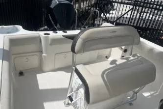 Slide: The Image of 2022 Sailfish 242 CC boat interior with seating and storage compartments. - 14