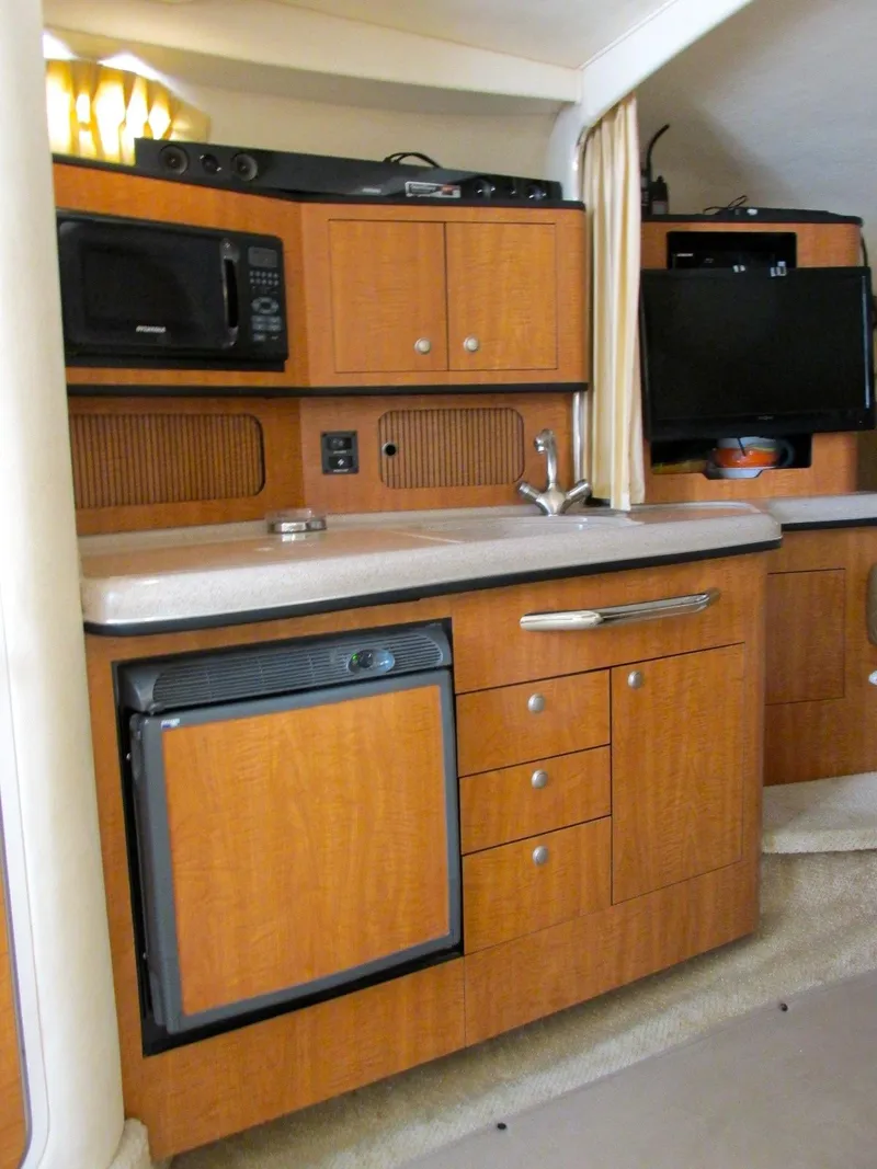 Slide: The Image of Galley in a 2006 Sea Ray 300 Sundancer yacht. - 12