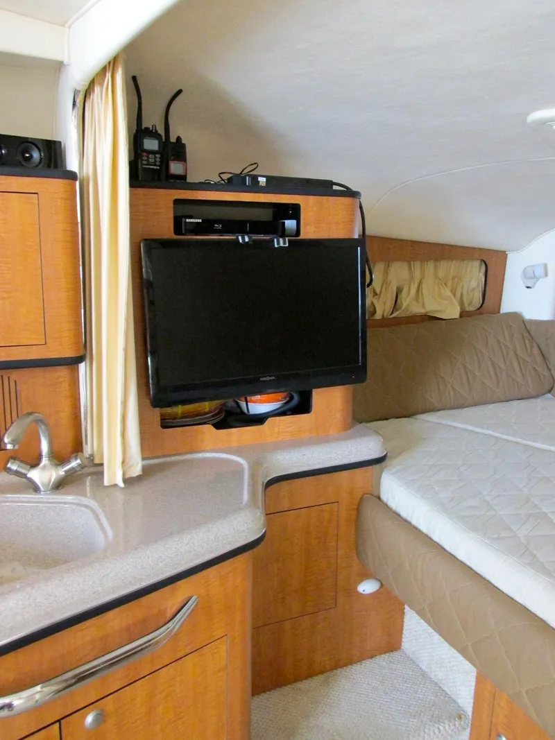 Slide: The Image of Interior of 2006 Sea Ray 300 Sundancer with TV and kitchenette. - 14