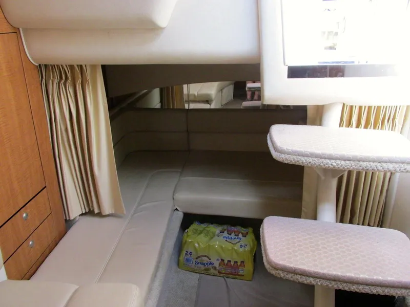 Slide: The Image of Interior of 2006 Sea Ray 300 Sundancer with seating area and stairs. - 16