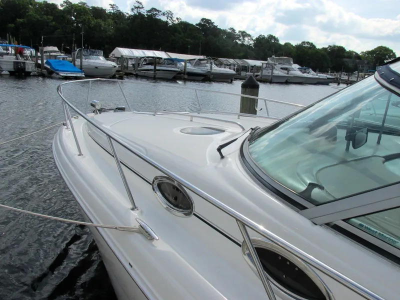 Slide: The Image of 2006 Sea Ray 300 Sundancer docked at marina. - 2