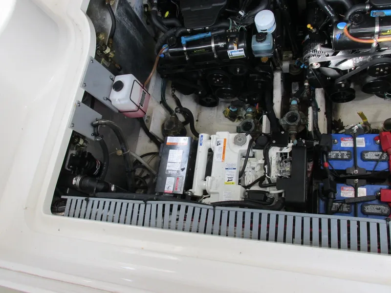 Slide: The Image of Engine compartment of a 2006 Sea Ray 300 Sundancer boat with batteries. - 21