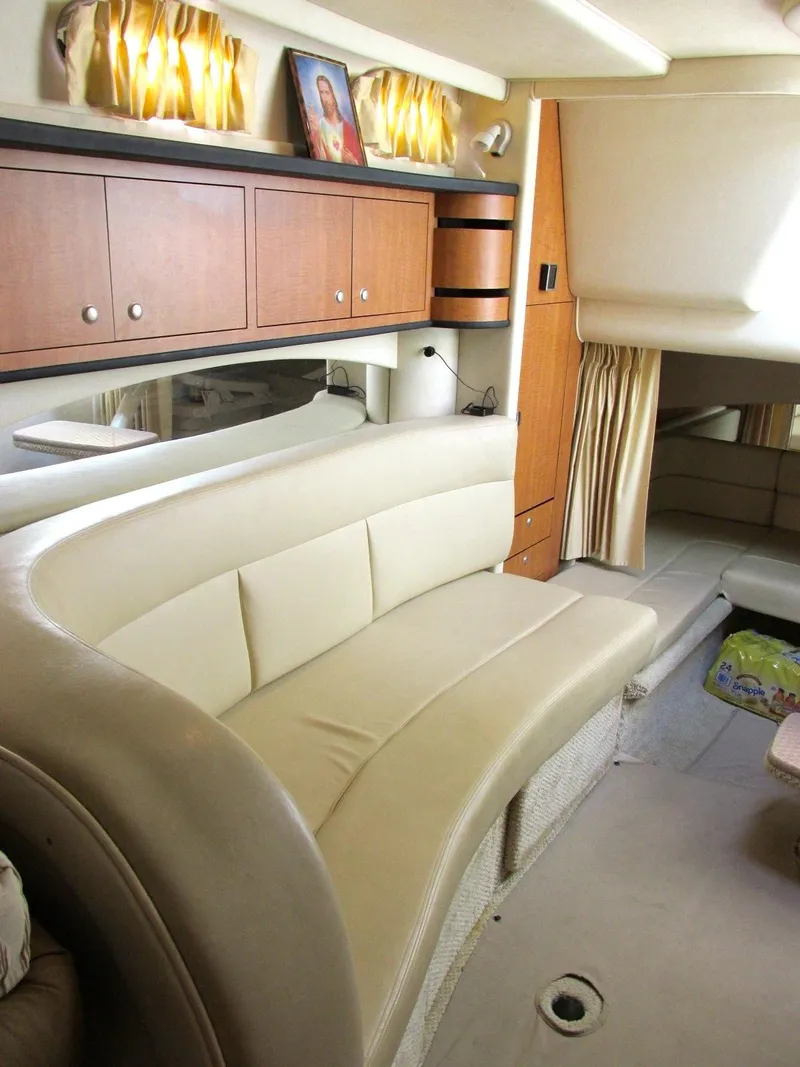 Slide: The Image of Interior of a 2006 Sea Ray 300 Sundancer yacht with leather sofa. - 25